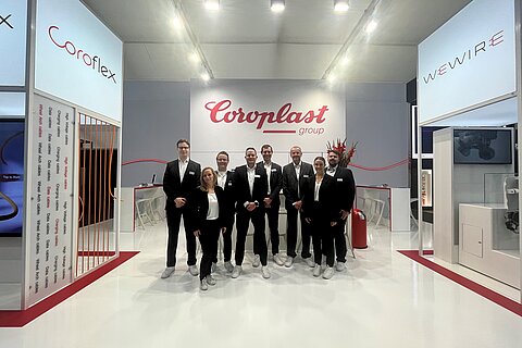 The eight members of the Coroplast Group trade show team at IZB 2024